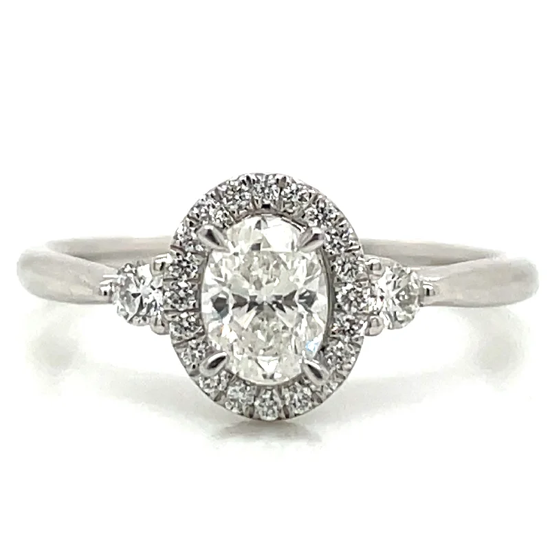 Remi - Platinum Natural 0.71ct Oval Halo Diamond Engagement Ring With Two Side Diamonds